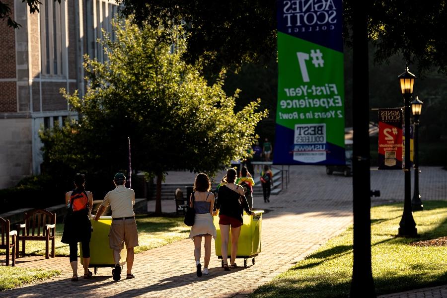 families of first-year students make their way down the main path of Agnes Scott College